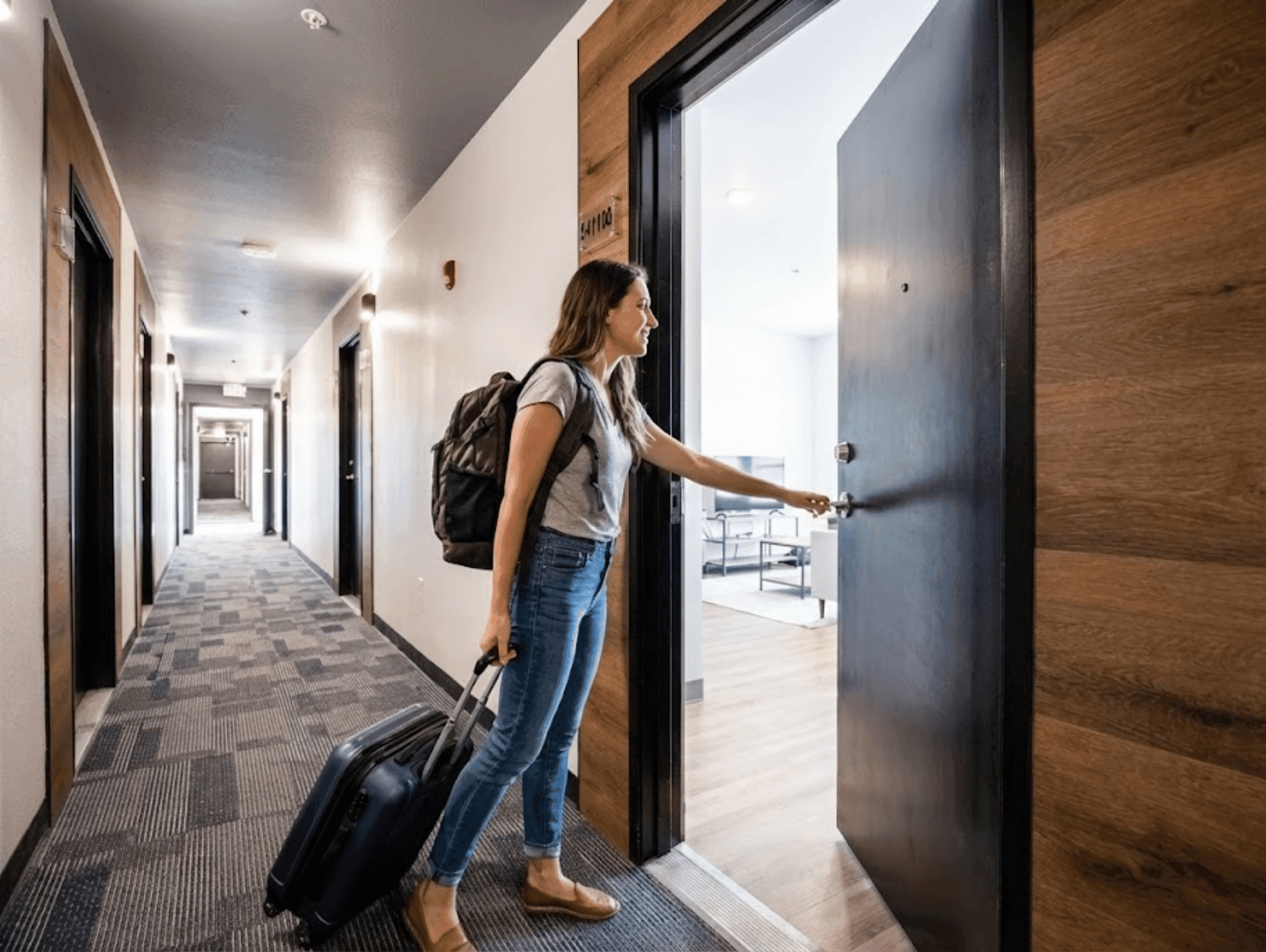 Woman walking into an apartment unit