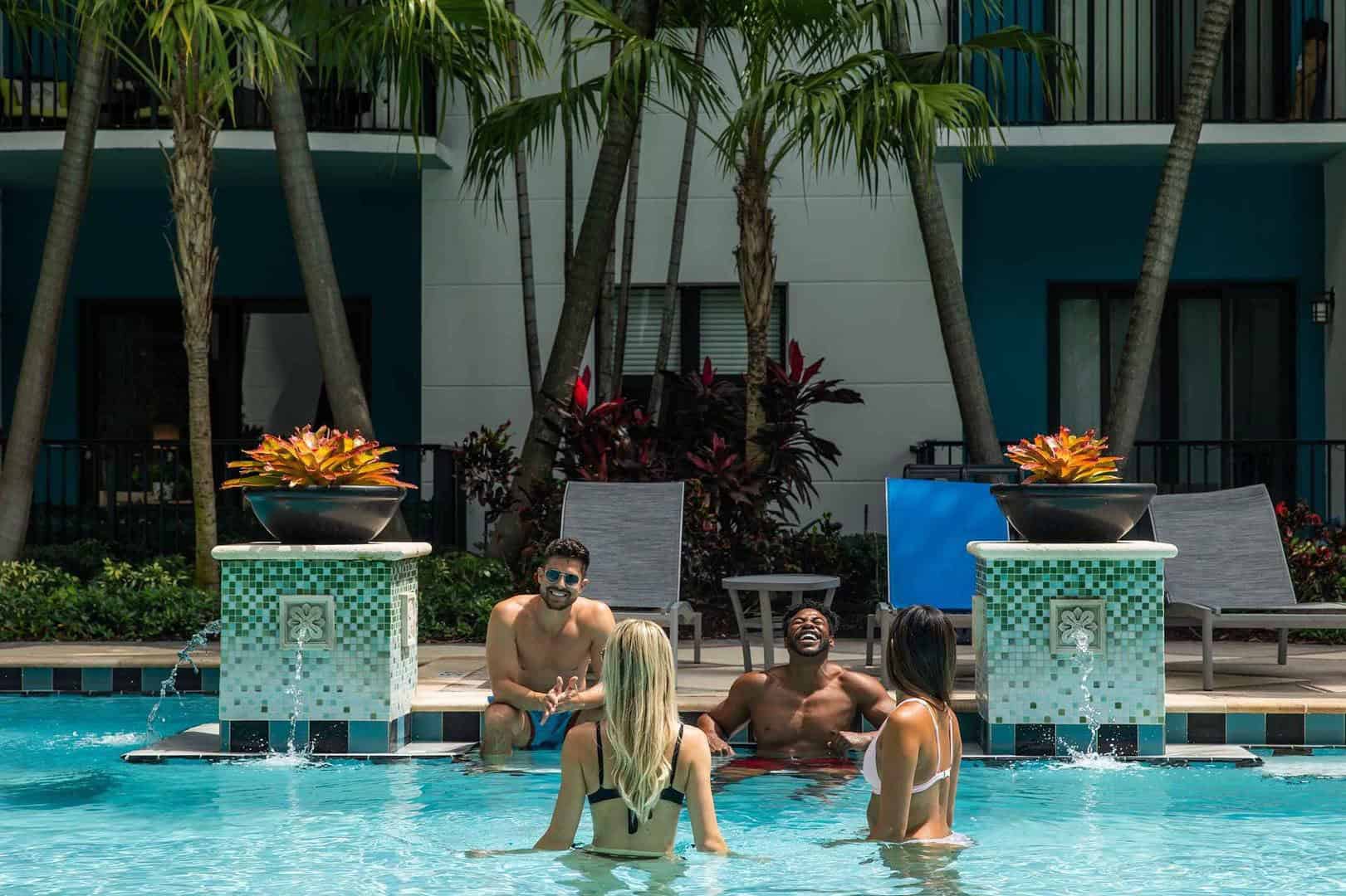 Friends hanging out in the Miami pool